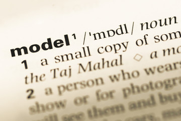 Obraz premium Close up of old English dictionary page with word model