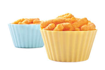 two plastic bowls of cheese puffs