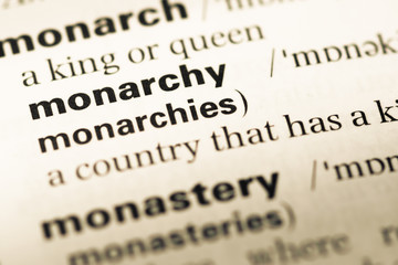 Close up of old English dictionary page with word monarchy