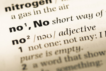 Obraz premium Close up of old English dictionary page with word no