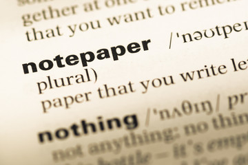 Fototapeta premium Close up of old English dictionary page with word notepaper