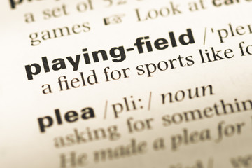 Fototapeta premium Close up of old English dictionary page with word playing field