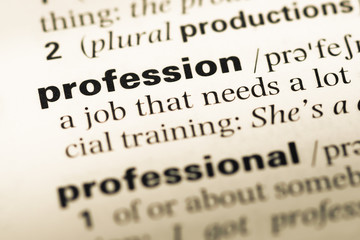 Obraz premium Close up of old English dictionary page with word profession