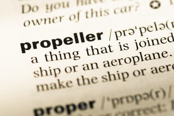 Obraz premium Close up of old English dictionary page with word propeller