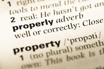 Fototapeta premium Close up of old English dictionary page with word property