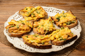 Sandwiches with fried eggs and cheese baked in oven.
