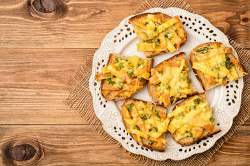 Sandwiches with fried eggs and cheese baked in oven.