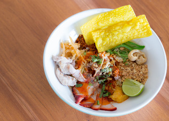 Noodle soup with soup on a wooden table.