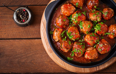 Meatballs in sweet and sour tomato sauce. Top view