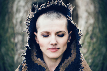 Closeup portrait of beautiful Caucasian white young bald girl woman with shaved hair head with...