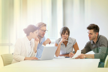 Fototapeta premium Business people meeting around table in modern space