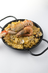 traditional spanish rice - paella isolated on white background