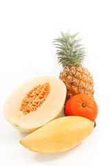 A Pineapple, A Mango, An Orange and A Half of Cantaloupe Melon Isolated, White Background