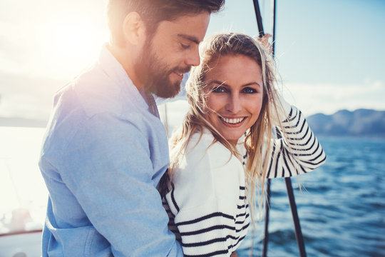 Young couple relaxing on yacht