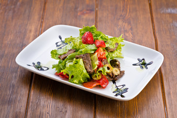delicious fresh salad with vegetables and meat