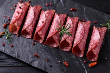 Fotobehang Delicious salami with basil and wine, selective focus © id-art
