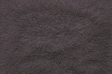 Dark minimalistic abstract background with metal particles. The texture.