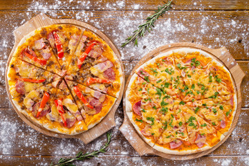two hot beautiful delicious Italian pizza with bacon cheese and vegetables