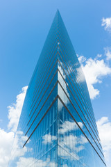 Fototapeta na wymiar modern glass building skyscraper blue sky editorial