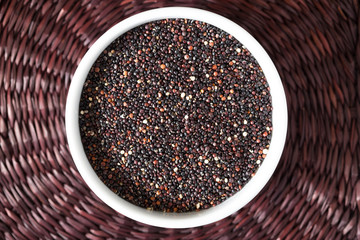 Portion of uncooked gluten free black Quinoa. Superfood
