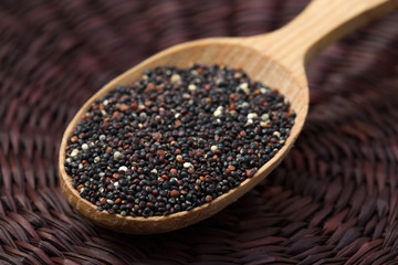 Portion of uncooked gluten free black Quinoa. Superfood