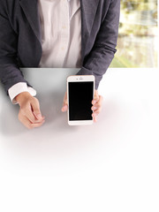 Touch screen smartphone in hand..