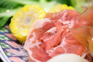 Raw pork on the plate for cooking