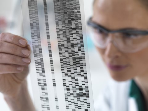 Scientist with DNA results