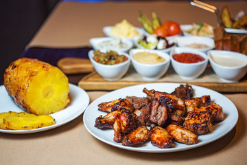 grilled meat dish on the background of sauces