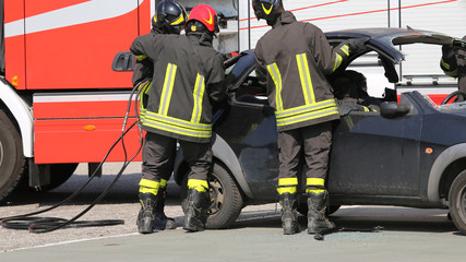 firefighters in action during the road accident
