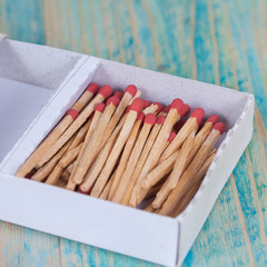 Matchsticks over wooden background