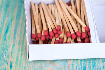 Matchsticks over wooden background