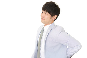 腰痛を訴えるビジネスマン