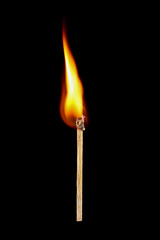Burning match stick isolated on black
