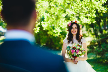 smiling bride goes to her future husband