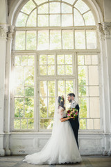 Charming young   couple standing in a beautiful  old place