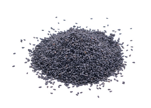 Pile of black sesame seeds on white background