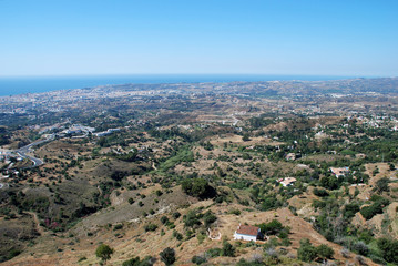 Fototapeta na wymiar Elevated view of Fuengirola along the coastline and surrounding countryside, Mijas.
