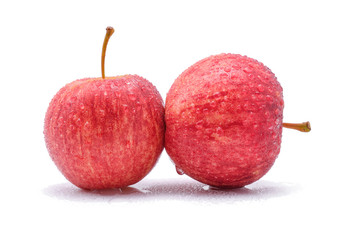 gala apples with drops of water on white background.