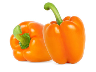 Two Colored orange bell peppers on white background