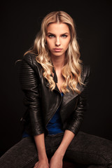 Fototapeta premium portrait of a fashion biker woman in leather jacket