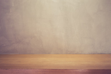 Grey wall and top wooden table or counter. For product display