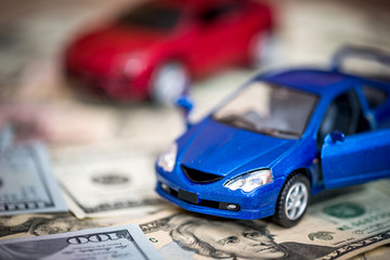 red and blue cars with dollar