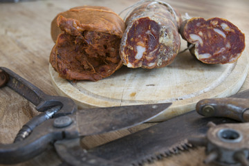 nduja and soppressata salami with old working tools