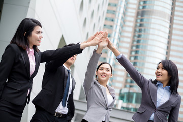 Business people raising up hands and joining together