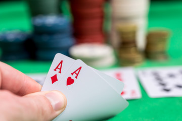 Woman in casino with two aces