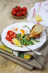 Fototapeta na wymiar Nice breakfast with vegetables and poached eggs