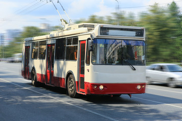 Plakat trolleybus going in the city