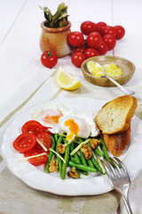 Nice breakfast with vegetables and poached eggs