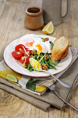 Nice breakfast with vegetables and poached eggs